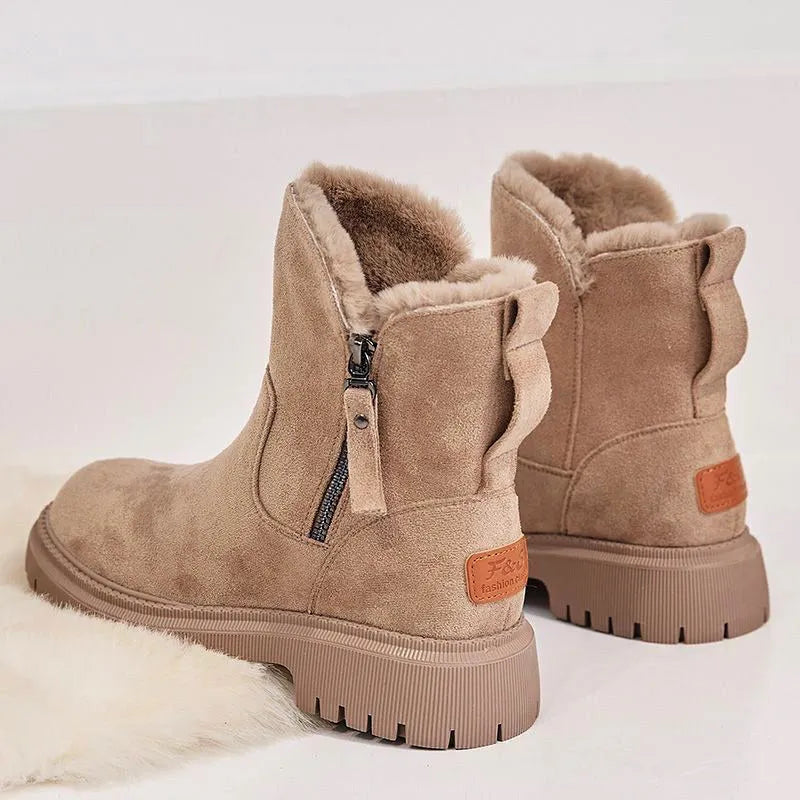 Women's black high-top faux suede snow boots with side zip and thick plush lining on a rubber sole.