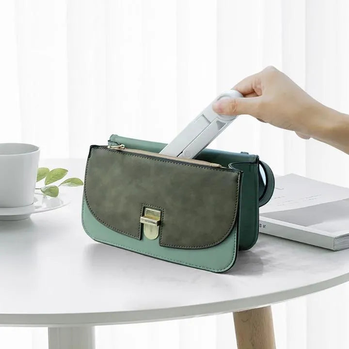 Black foldable tablet holder showing adjustable angles and rubber surface for device protection