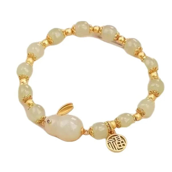 Green lucky jade hare bracelet for women with Chinese zodiac animal design and electroplated finish.