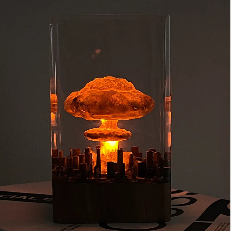 Small resin night lamp shaped like an atomic bomb mushroom cloud explosion in two colour variants.