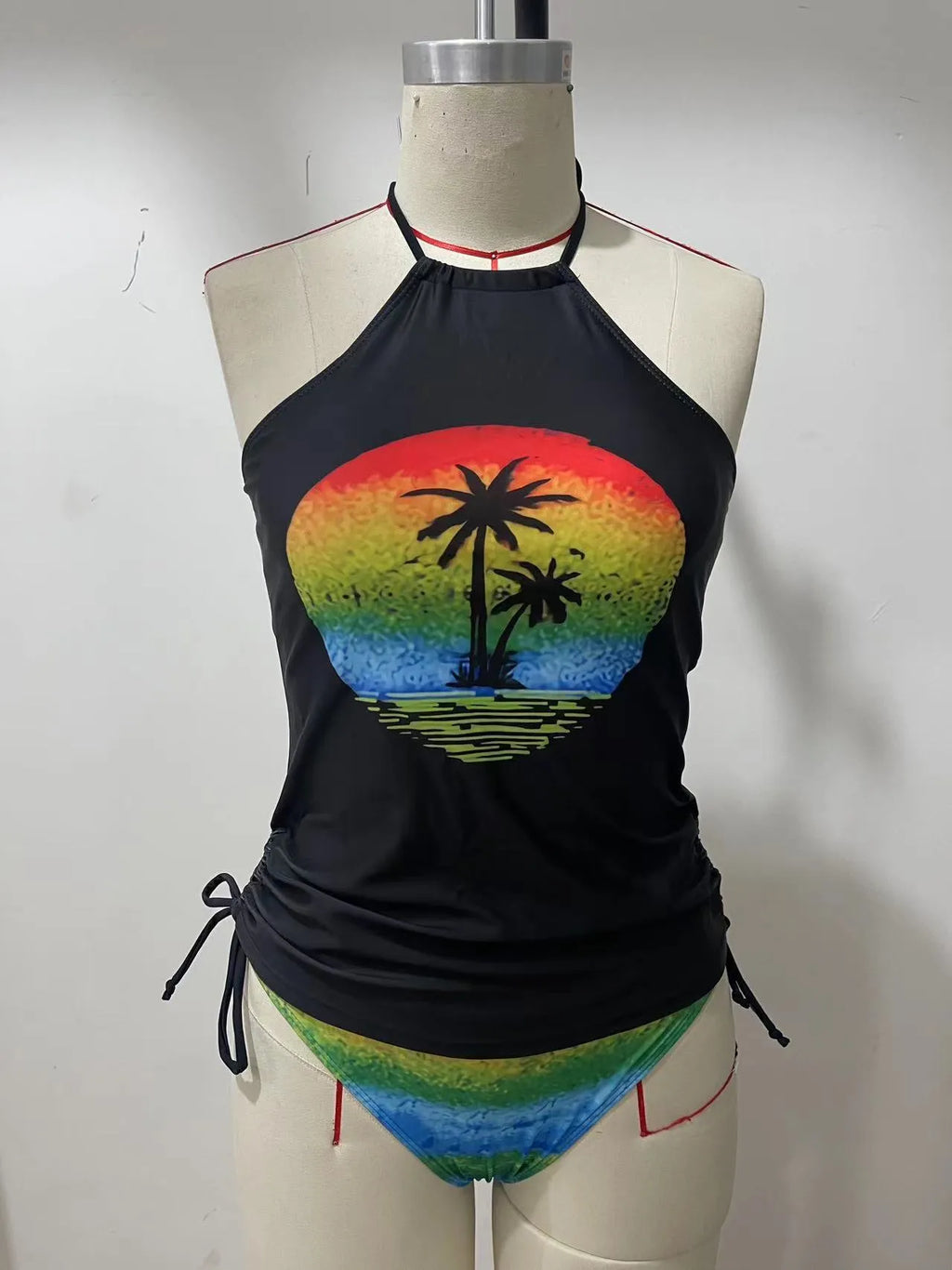 Conservative style women's swimsuit with colourful cartoon print and matching shorts.