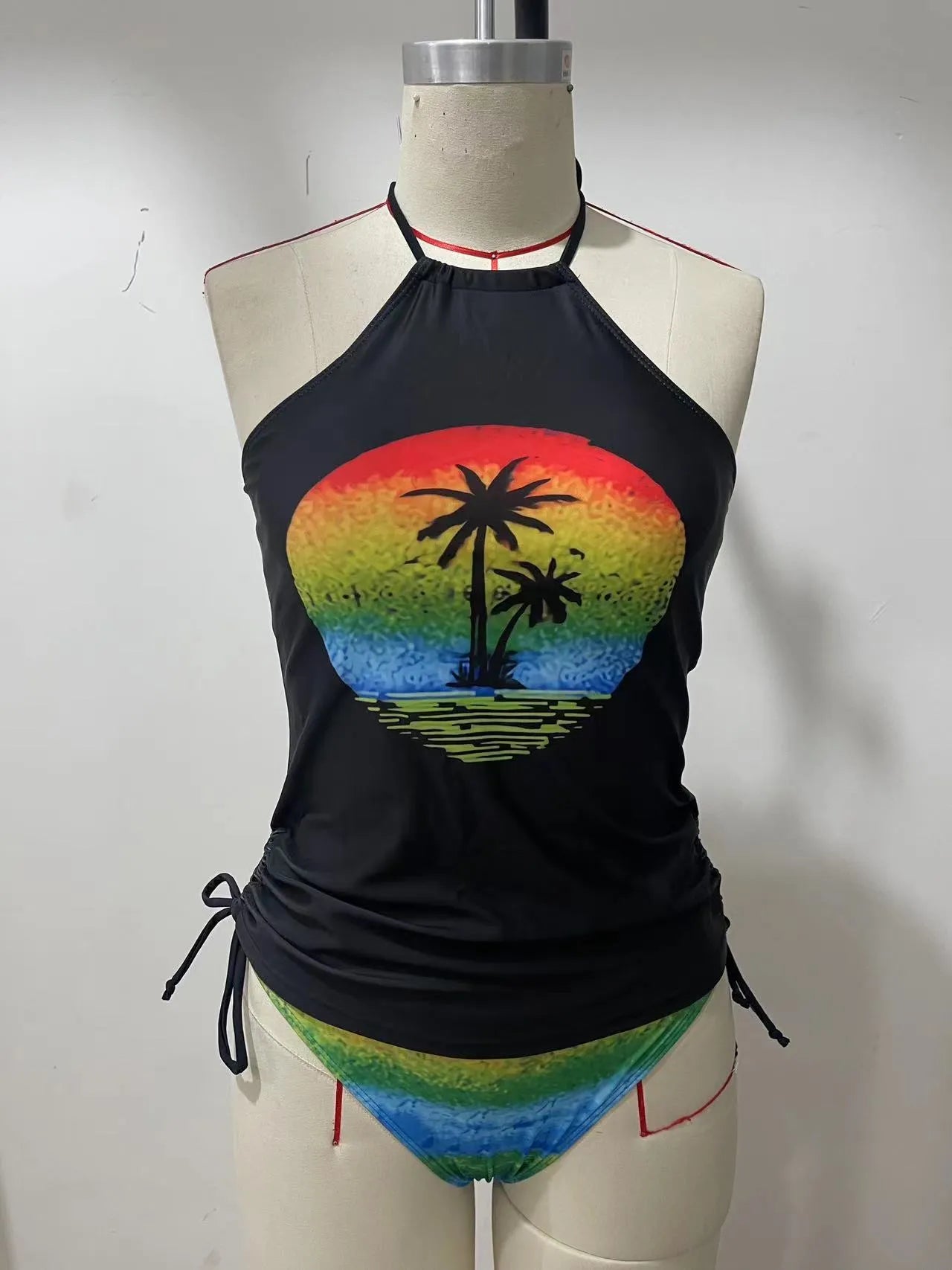 Conservative style women's swimsuit with colourful cartoon print and matching shorts.