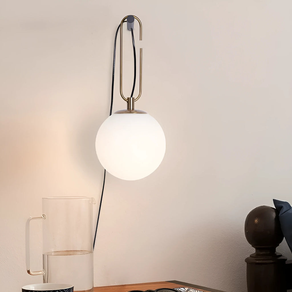 Nordic modern glass wall lamp on a white wall displaying warm white light.