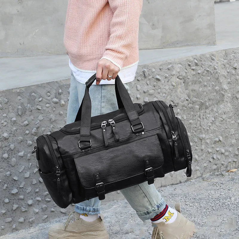 Black large capacity travel bag with separate shoe compartment, closed view.