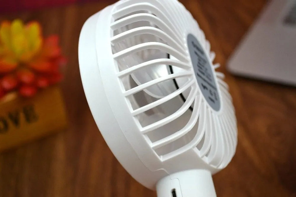 White ORICO FH1 rechargeable USB desktop and handheld fan showing fine line details on its ABS shell.
