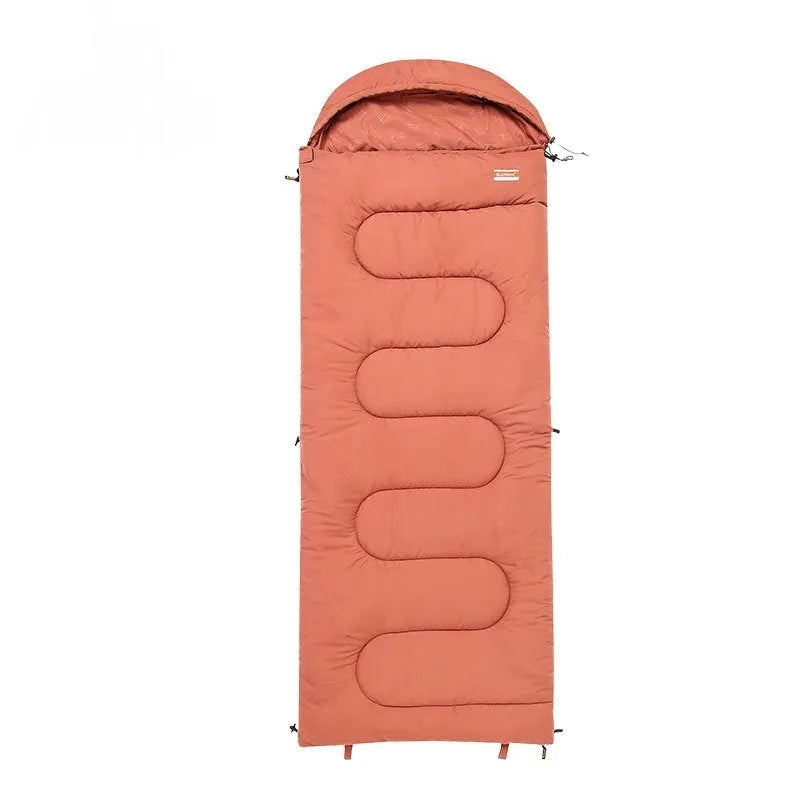 Ochre and olive green portable cotton camping sleeping bag quilt laid flat.
