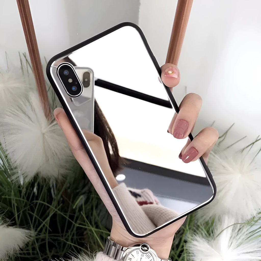 Black iPhone phone case with a built-in circular mirror on the back, shown next to an iPhone.