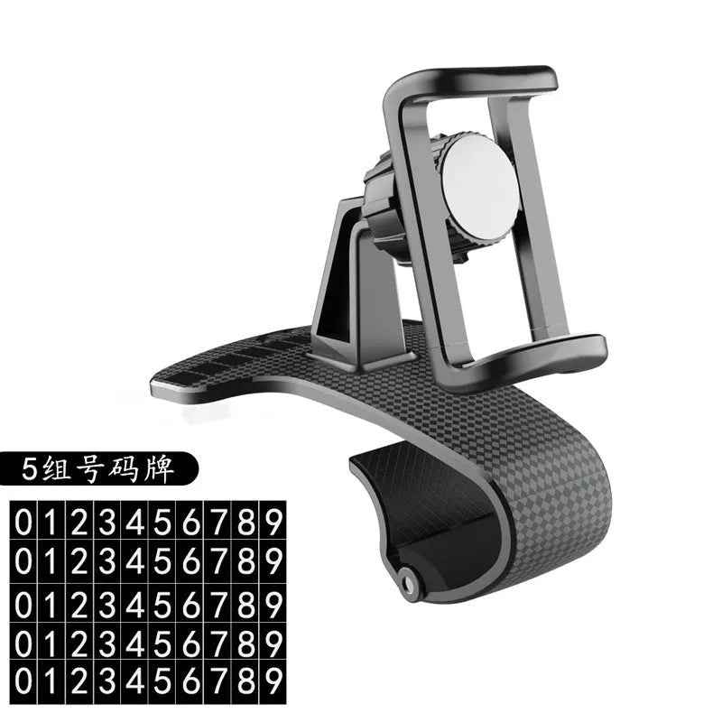 Black 360-degree rotating car phone holder with an adjustable width cradle on a car dashboard.
