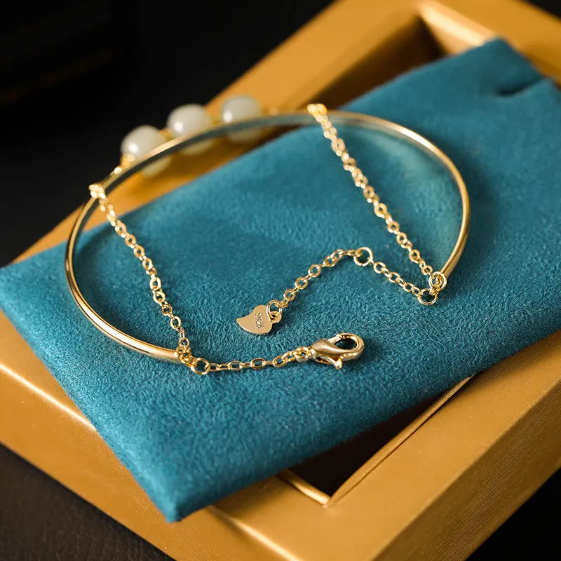 Hetian jade lucky beads bracelet with gold inlay treatment in women's fake two pieces style