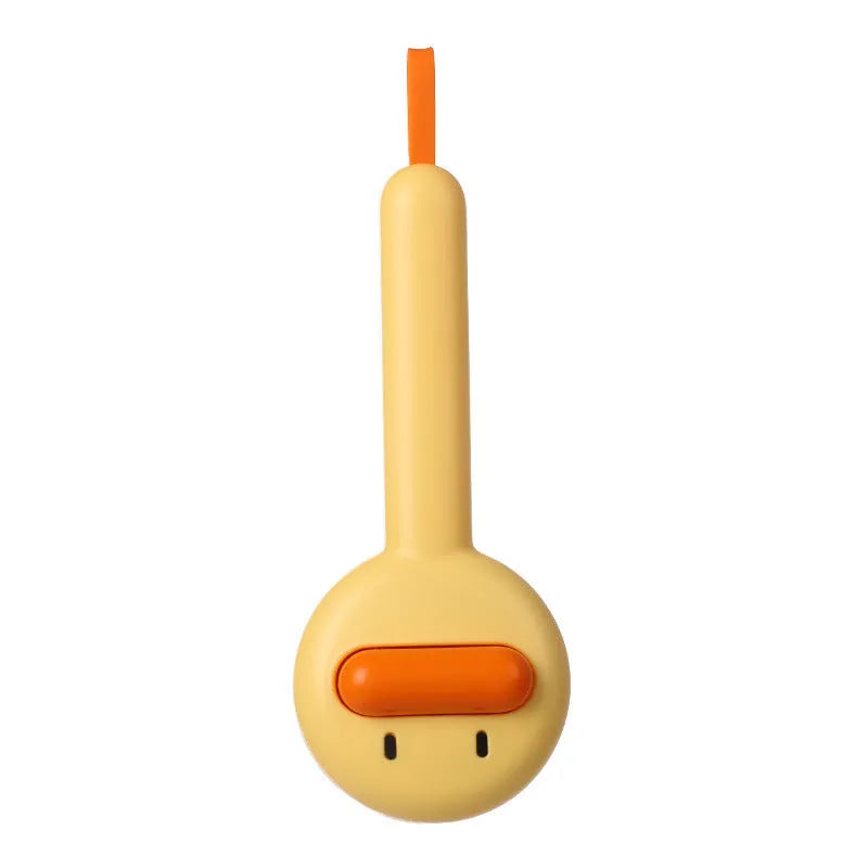 Small yellow duck-shaped pet grooming comb with open sections for cats and dogs