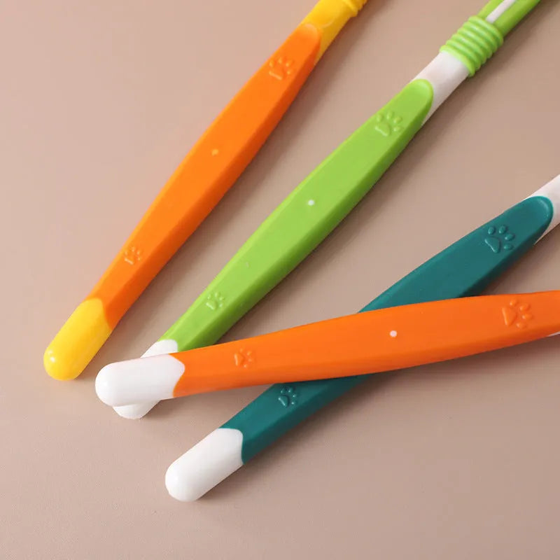 Pet toothbrush in orange, green, yellow, blue pink, black yellow or dark green colours with plastic handle and nylon bristles