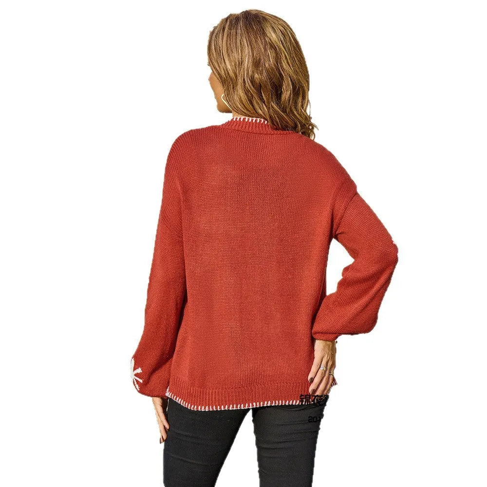 Beige Jacquard floral pattern knitted coat on a hanger, showing loose cardigan style and regular sleeves.