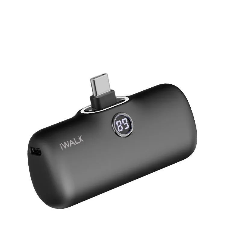 White mini lipstick-shaped power bank showing built-in screen display on black background