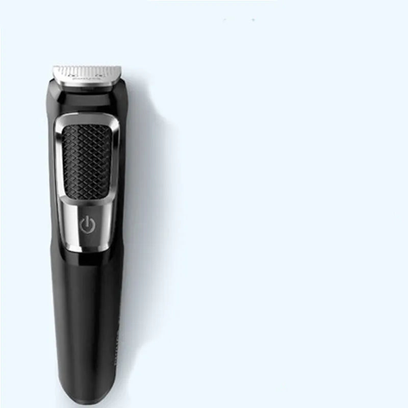 Rechargeable nose and beard hair clippers with a cleaning brush on a white background.