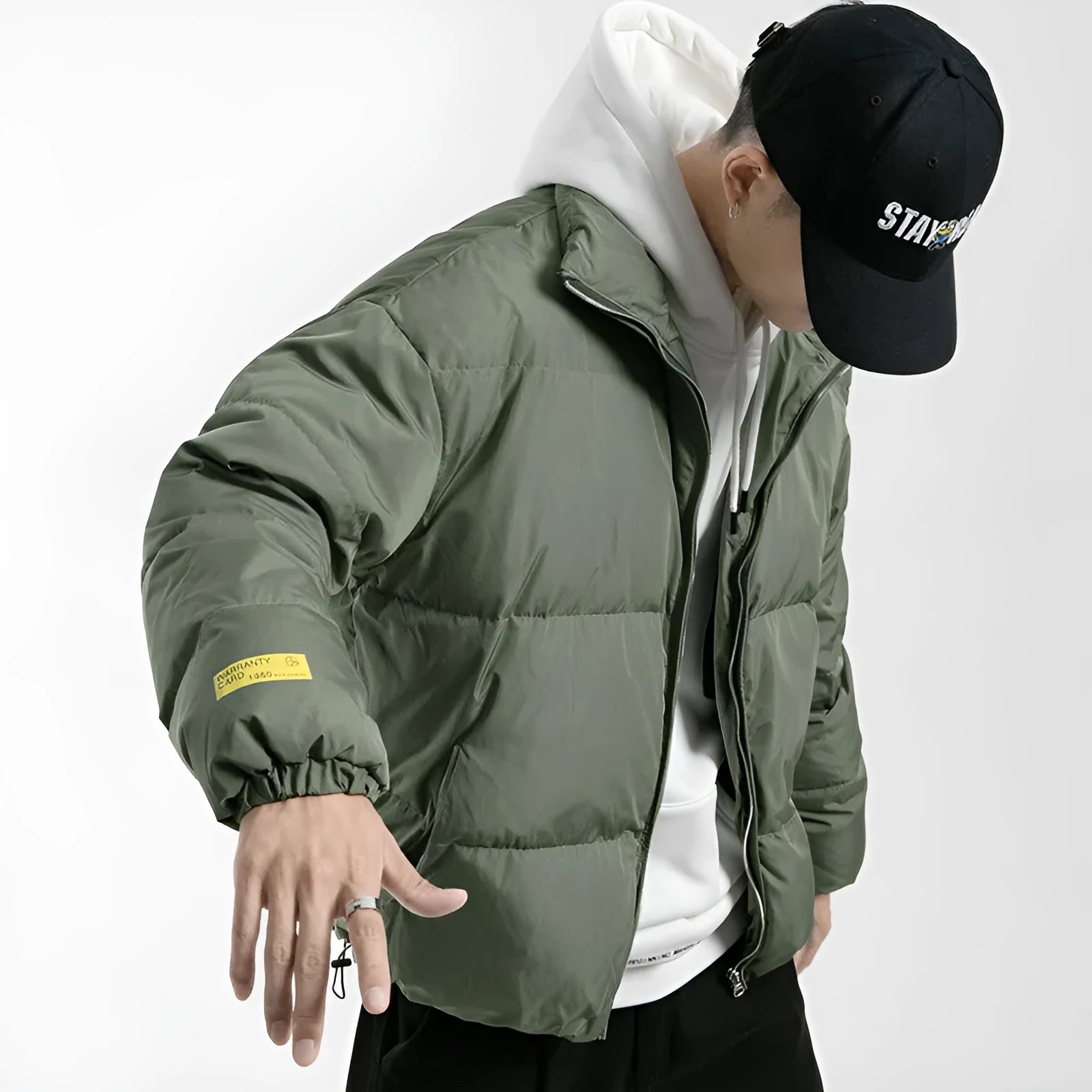 Men's stand collar padded jacket in black, polyester filling, zipper front, side slit pockets, straight hem, loose fit