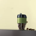 Coffee cup shaped car perfume air freshener in five colour options on car dashboard