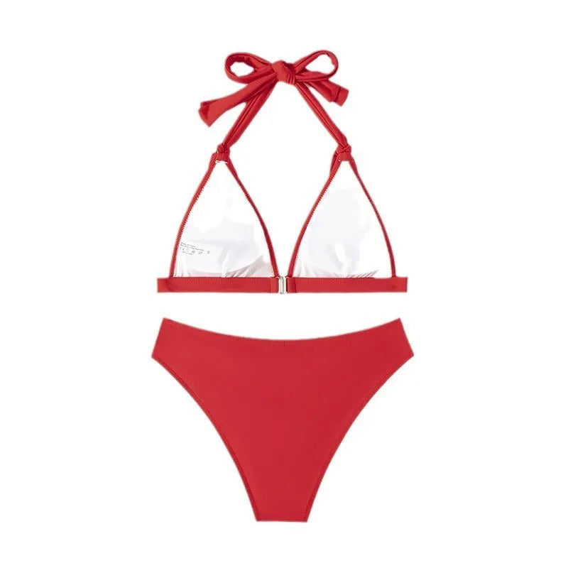 Red women's lace-up halterneck bikini top with matching split shorts.