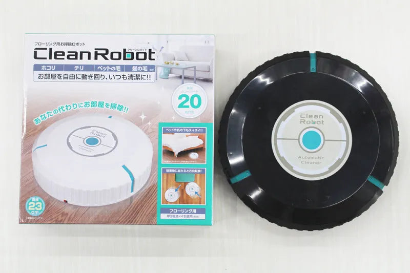 Black and white ABS plastic automatic robot vacuum cleaner on a wooden floor.