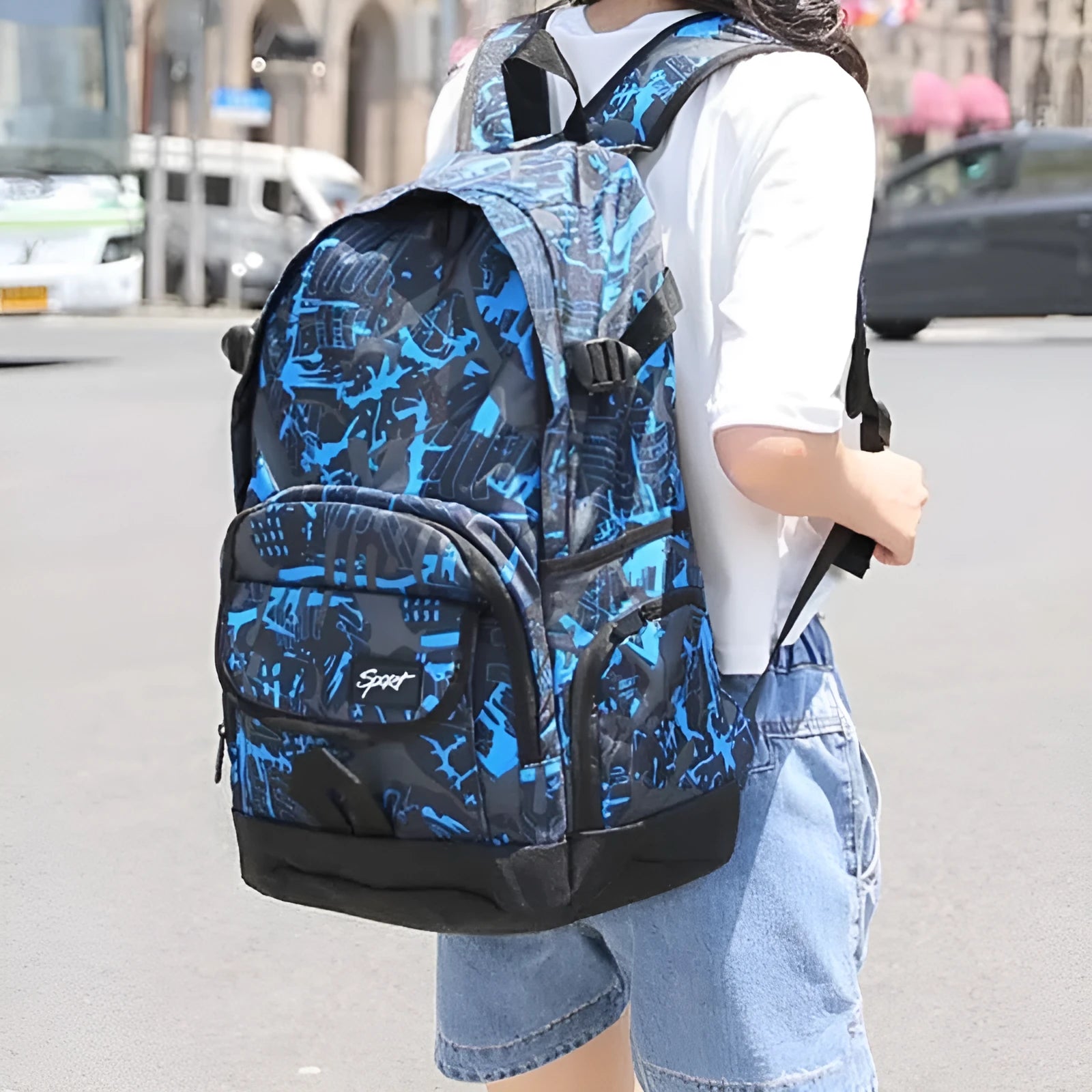 Blue classic nylon large capacity backpack shown upright, with a red colour option available.