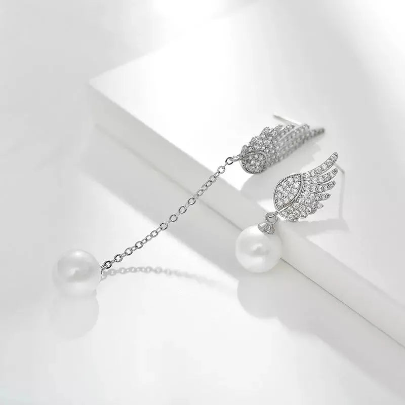 Silver angel wing earrings with diamond treatment and gold-plated gemstone inlay in platinum colour