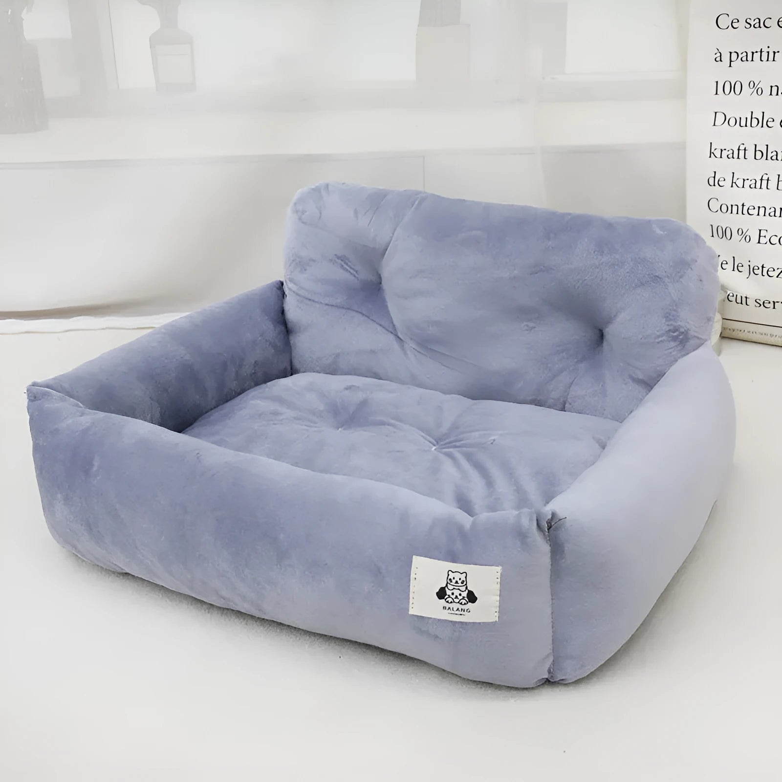 Grey and blue plaid cloth car pet bed for dogs shown in small and large size options.