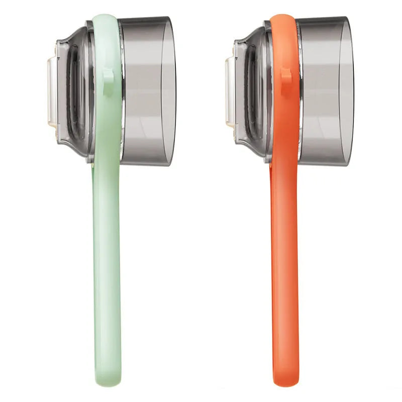 Light green plastic kitchen peeler with built-in storage bucket and scraper function.
