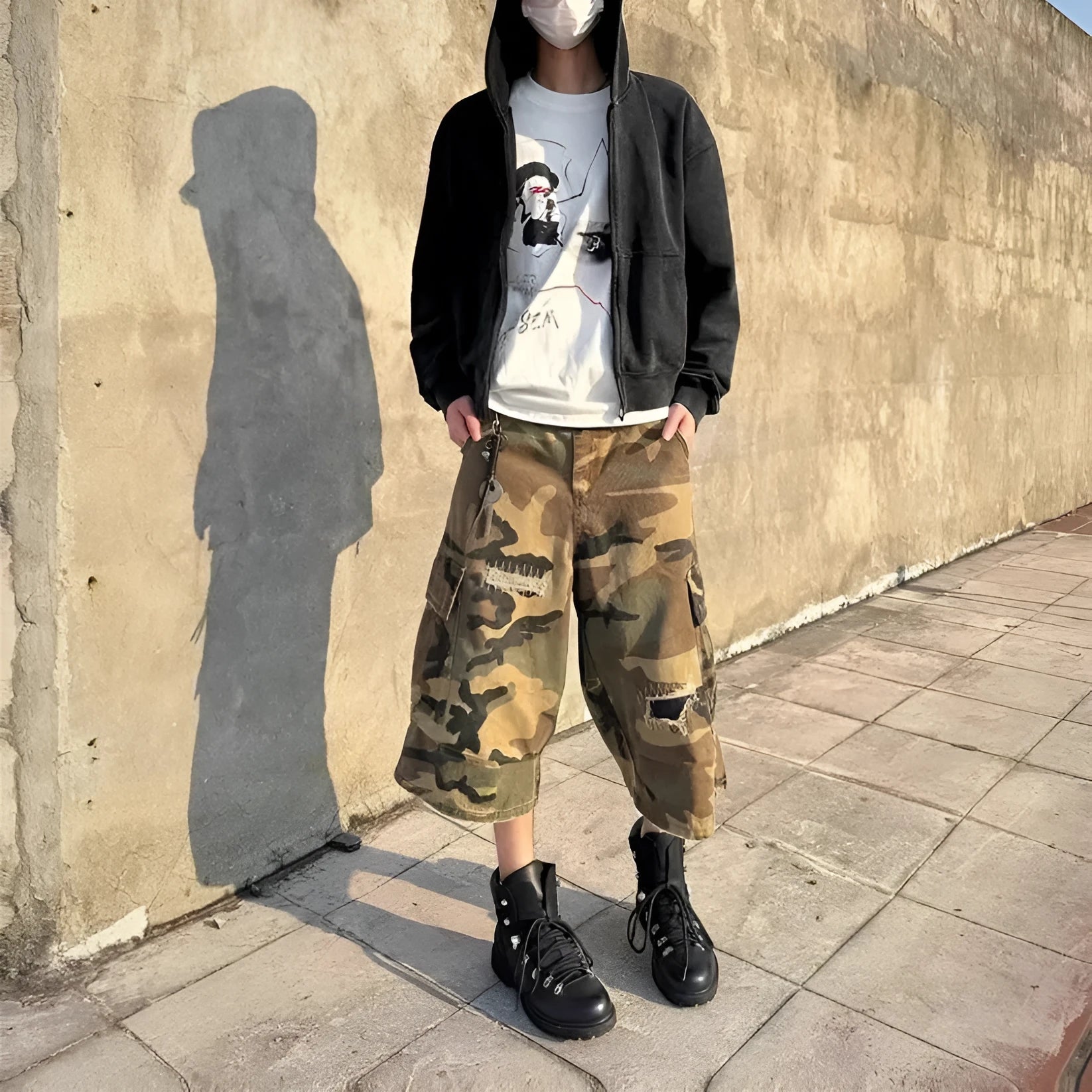 Men's camouflage cropped pants with ripped patches and straight leg cut