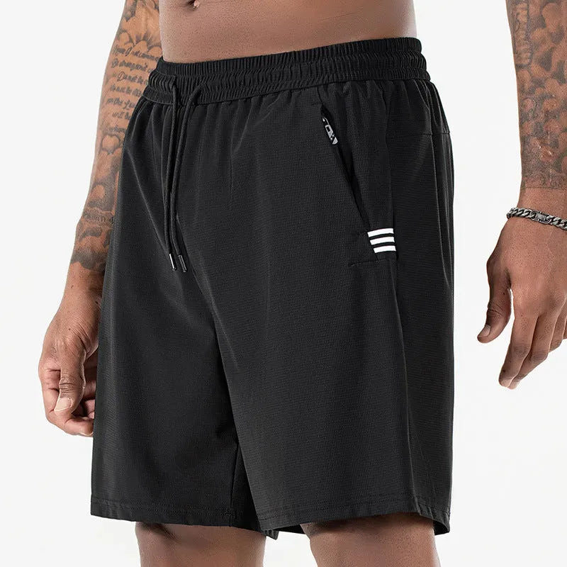 Man wearing black ice silk quick-drying sports shorts with drawstring waist.