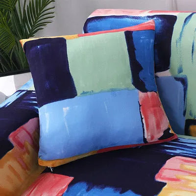 Geometric pattern stretch sofa slipcover and matching cushion cover on a double seat sofa.