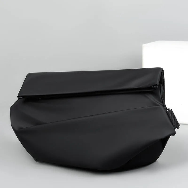 Grey horizontal square men's crossbody bag made of PU leather with a zipper and shoulder strap.