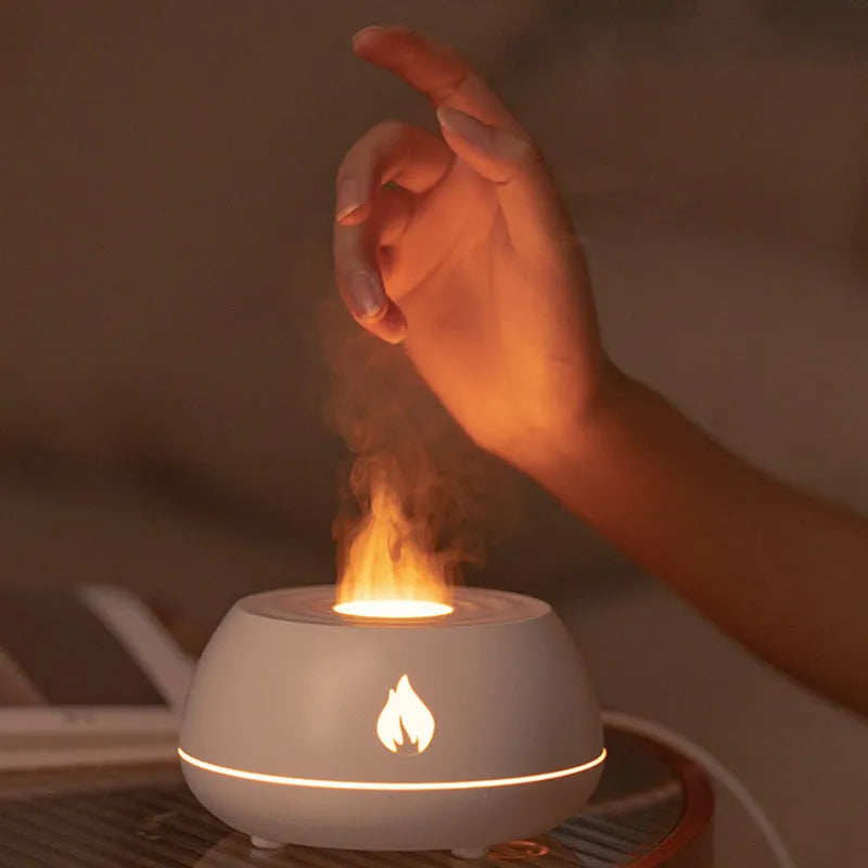 Black flame humidifier aroma diffuser with 130ml tank, 7 colour lights, and USB power on a wooden table