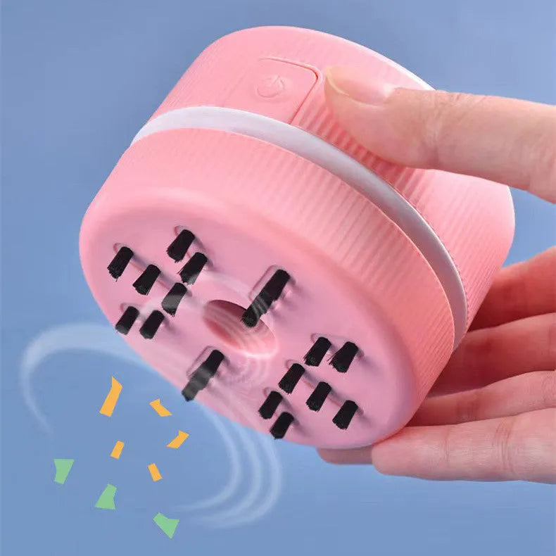 Mini desktop handheld vacuum cleaner in pink colour for pencil eraser chip cleaning