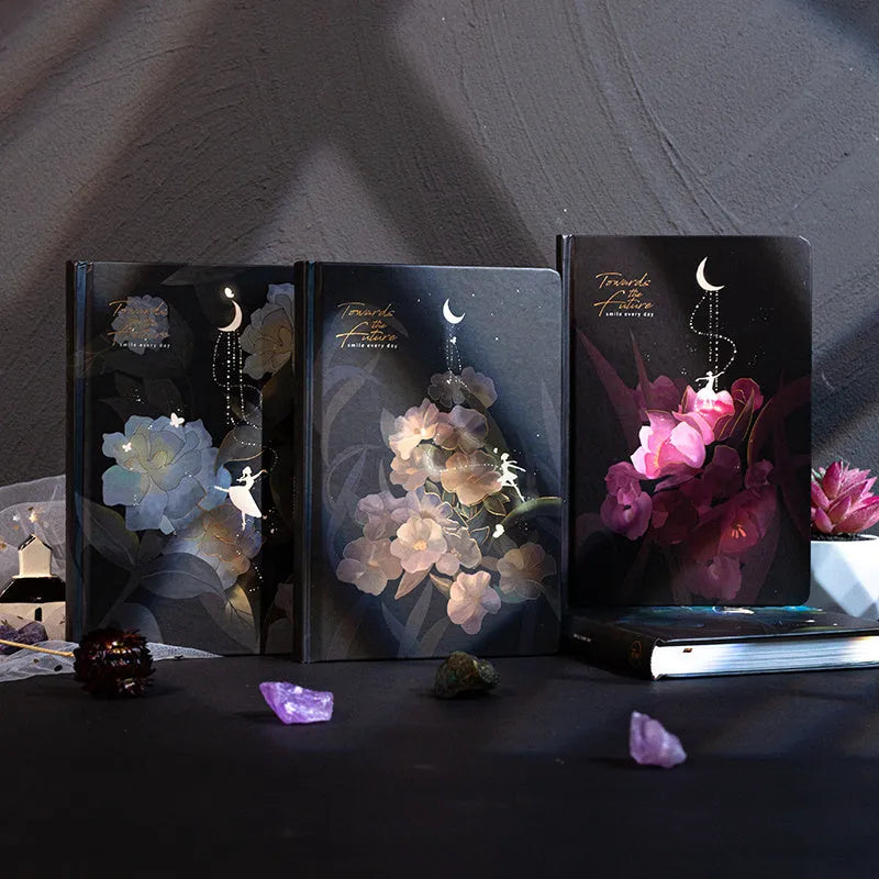 A5 diary book with a luminous purple cover, open to show pages with colour illustrations.