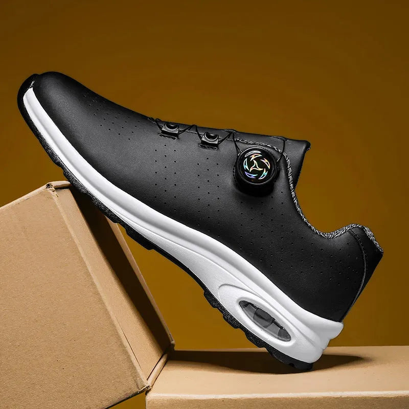 Men's low top black mesh casual shoes with white composite sole and cross shoulder straps.