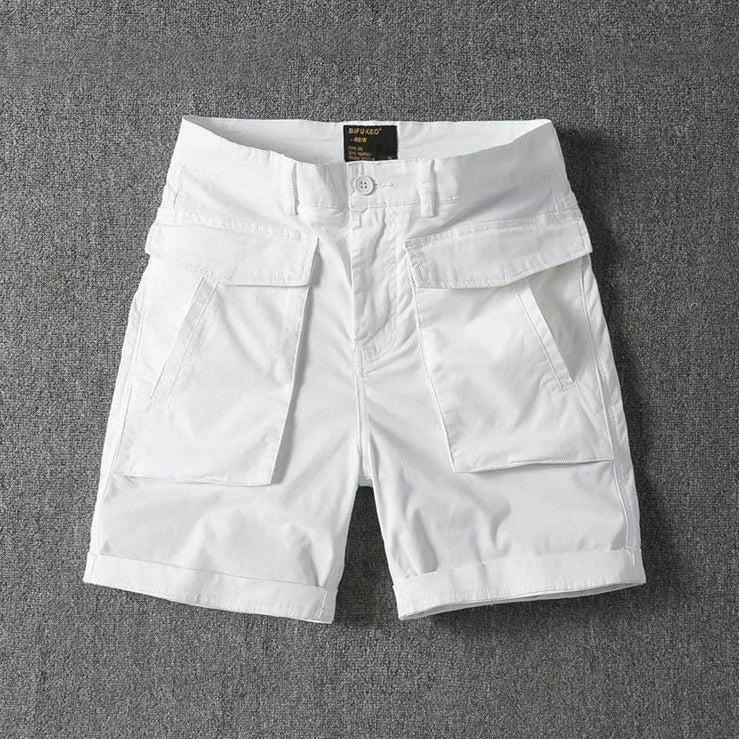 Men's straight-leg cotton cargo shorts with stretch in multiple colour options on a size chart.