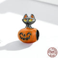 Close-up of sterling silver pumpkin black cat pendant with black gold plated oil dripping finish