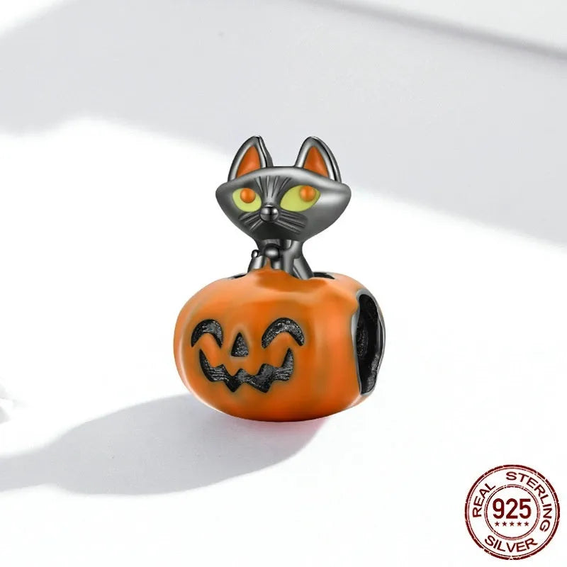 Close-up of sterling silver pumpkin black cat pendant with black gold plated oil dripping finish