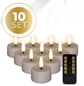 Four taupe-coloured LED tealight candles with glowing 3D flame effect on a dark surface.