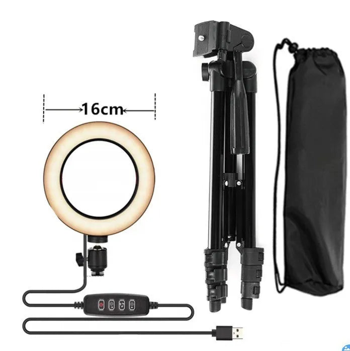 Adjustable silver live phone stand with tripod base extended to full height holding a mobile phone.