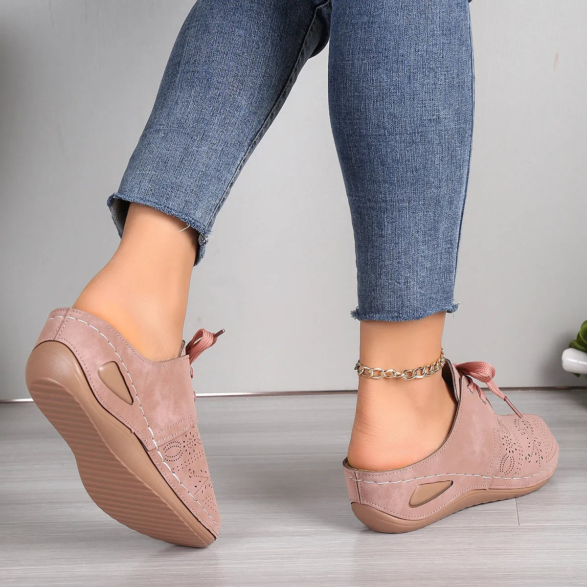 Women's black baotou lace-up slippers with hollow out wedge and suede upper on a rubber sole