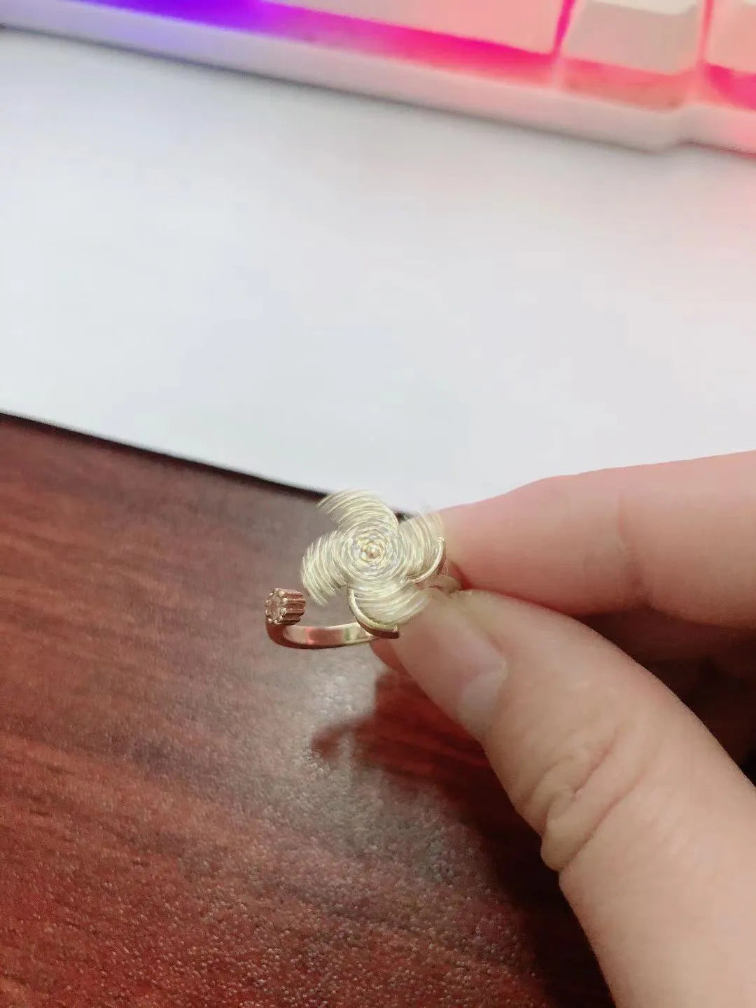Gold and silver rotating geometric ring with micro-inlaid mechanism and electroplated finish
