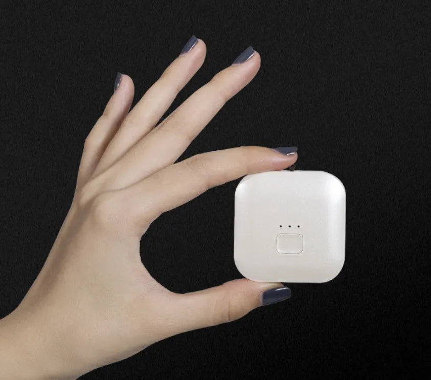 Mini USB rechargeable air purifier necklace in blue, shown with charging cable.