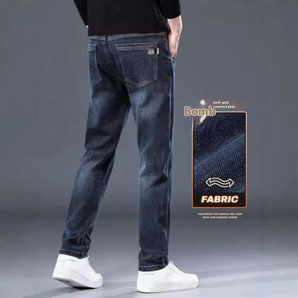 Blue grey slim straight casual trousers with a zipper fly on a mid-waist.