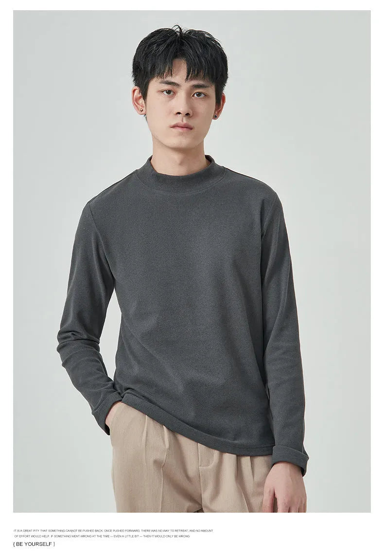 Man wearing a beige Dralon long sleeve T-shirt with a half-high collar, casual autumn outfit.