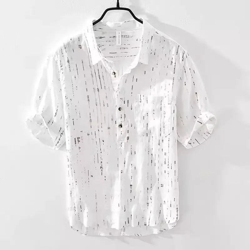 Man wearing a loose-fit black short-sleeve polo shirt, a summer casual style.
