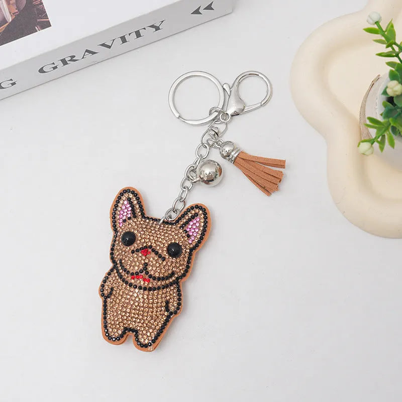 Rhinestone cartoon French bulldog keychain pendant on a diamond-shaped alloy base.