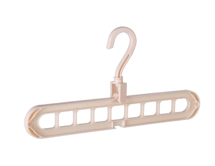 Pink plastic clothes hanger with a rotating hook on a white background.