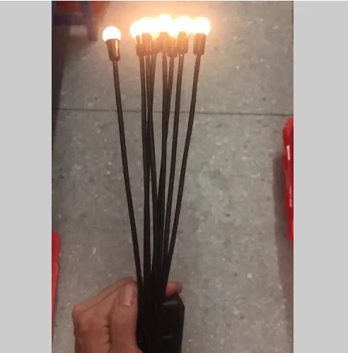 Solar-powered LED garden light with multiple heads on stainless steel ground spikes