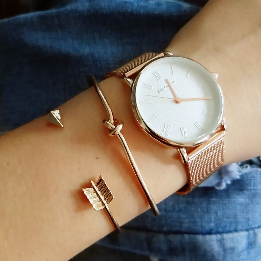 Gold vintage cuff bracelet for women with an arrow design and knotted detail.