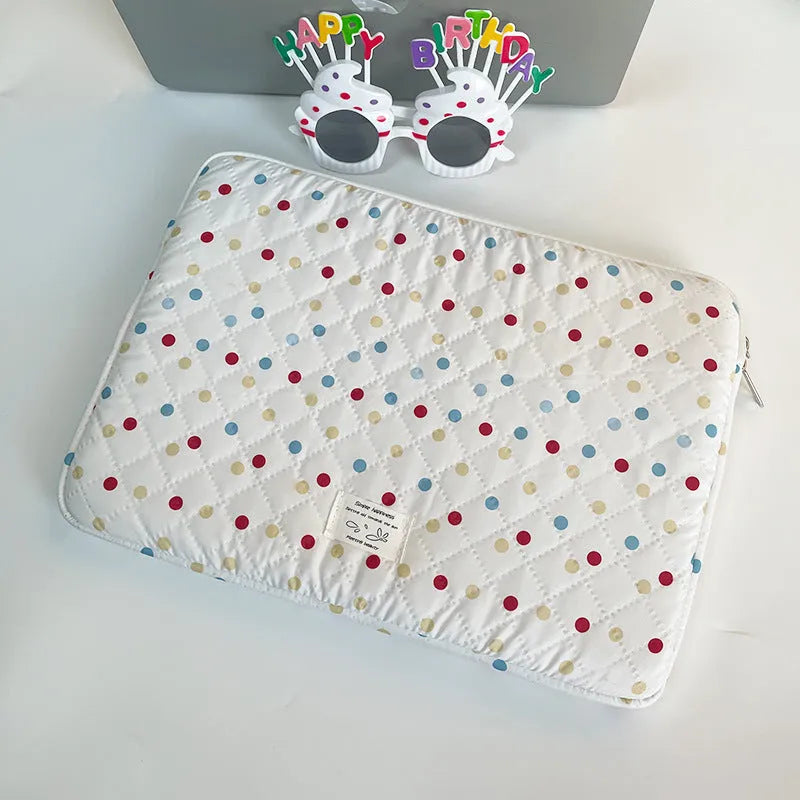 Women's polka dot polyester laptop bag shown in solid colour with size options for 11-inch to 15.6-inch laptops.